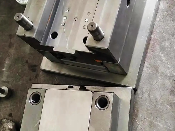 What are the components of a stamping die?